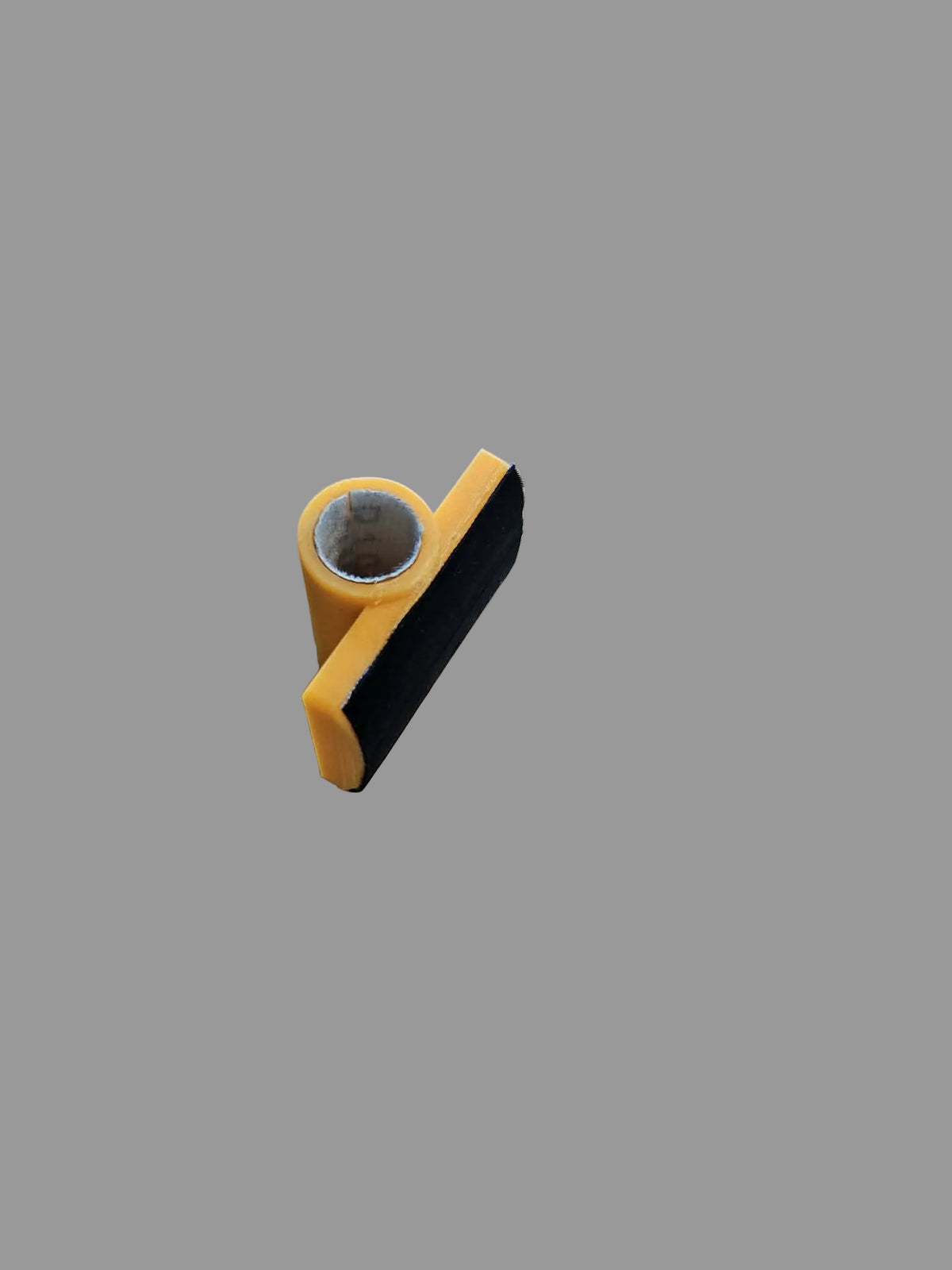 "Rail Mate yellow 3D-printed billiard rail bridge angled view showing cue ferrule opening and black rubber grip base — LH Inventions pool table rail cue bridge"