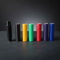 Shaft Mate 3D-printed pool cue shaft sleeves in black, yellow, green, red, purple, and blue — full color lineup on dark surface showing textured grip and hollow cue ferrule opening